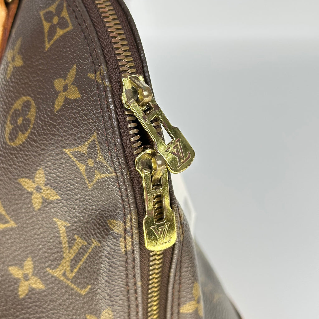 Louis Vuitton Alma Monogram Handbag M51130