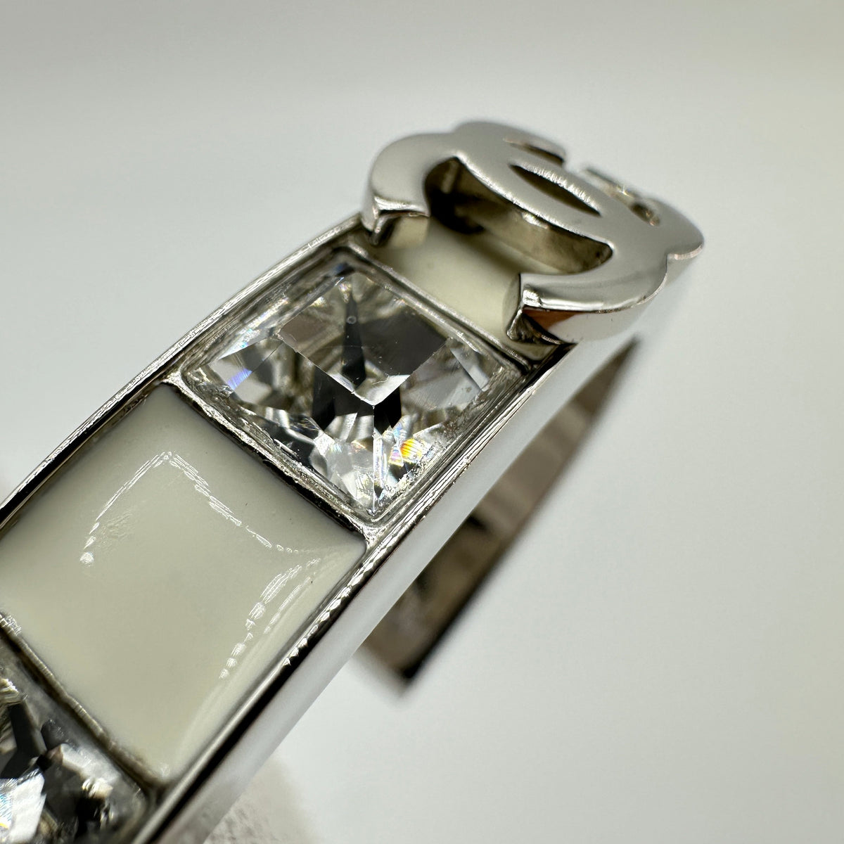 Chanel Silver White Enamel Crystal Coco Mark Bangle Bracelet