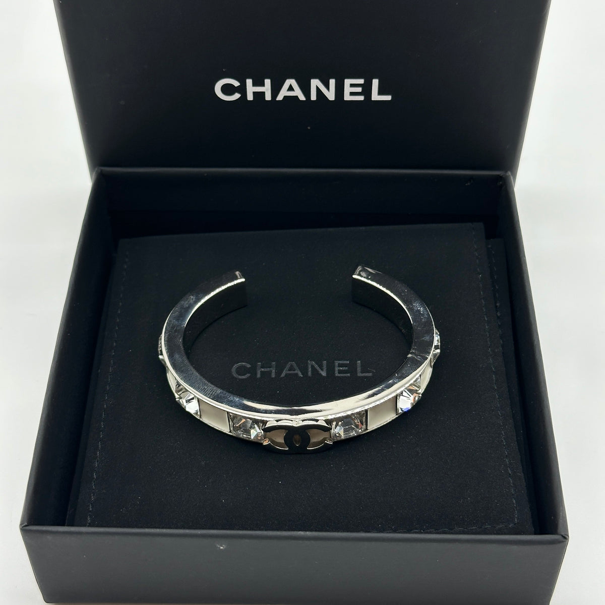 Chanel Silver White Enamel Crystal Coco Mark Bangle Bracelet