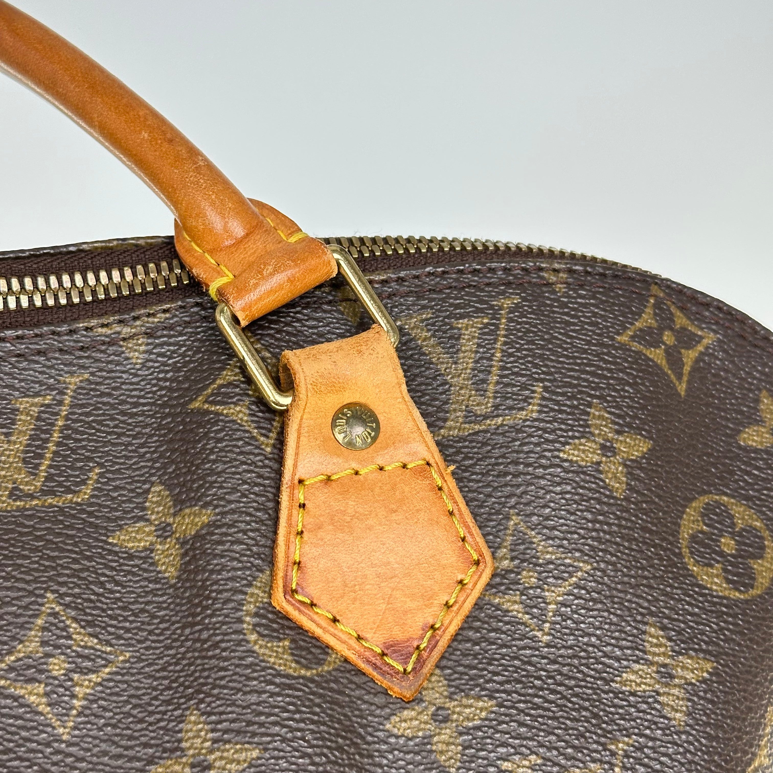 Louis Vuitton Alma Monogram Handbag M51130
